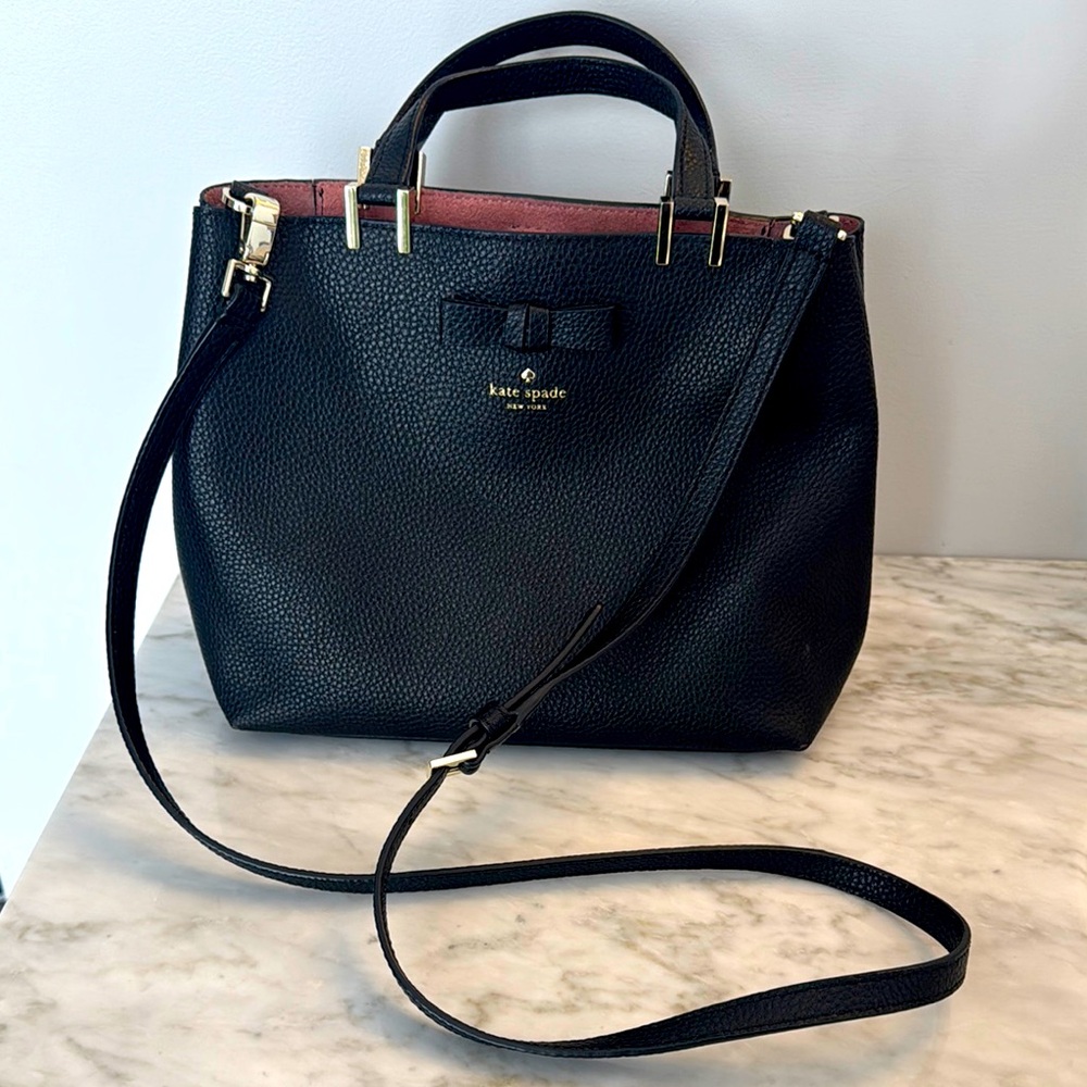 Gently used Kate Spade black pebbled leather bag with bow detail.